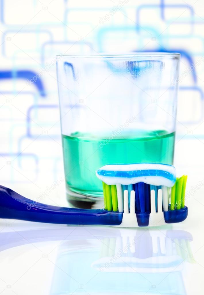 depositphotos 95705596 stock photo toothbrush mouthwash in a glass